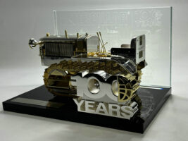 ¾ FRONT VIEW OF 85689 PREMIUM CENTENARY MODEL. GOLD/SILVER ON BASE DISPLAY WITH 100 YEAR LOGO